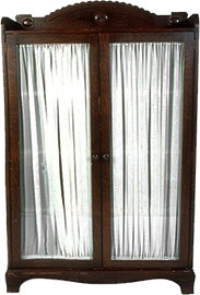 armoire made of dark wood with curtains
